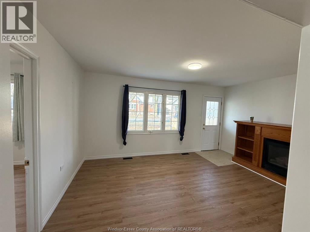 3693 Queen Street, Windsor, ON - Indoor Photo Showing Other Room With Fireplace