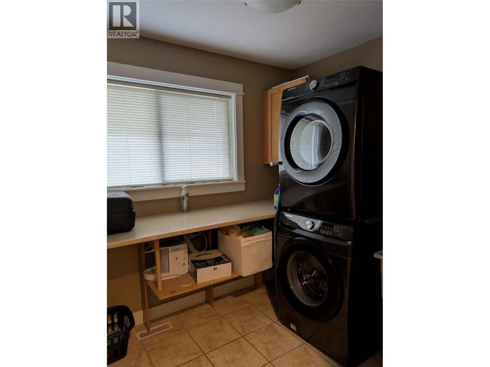 Second Level - 3576 Rose Road, Kelowna, BC - Indoor Photo Showing Laundry Room