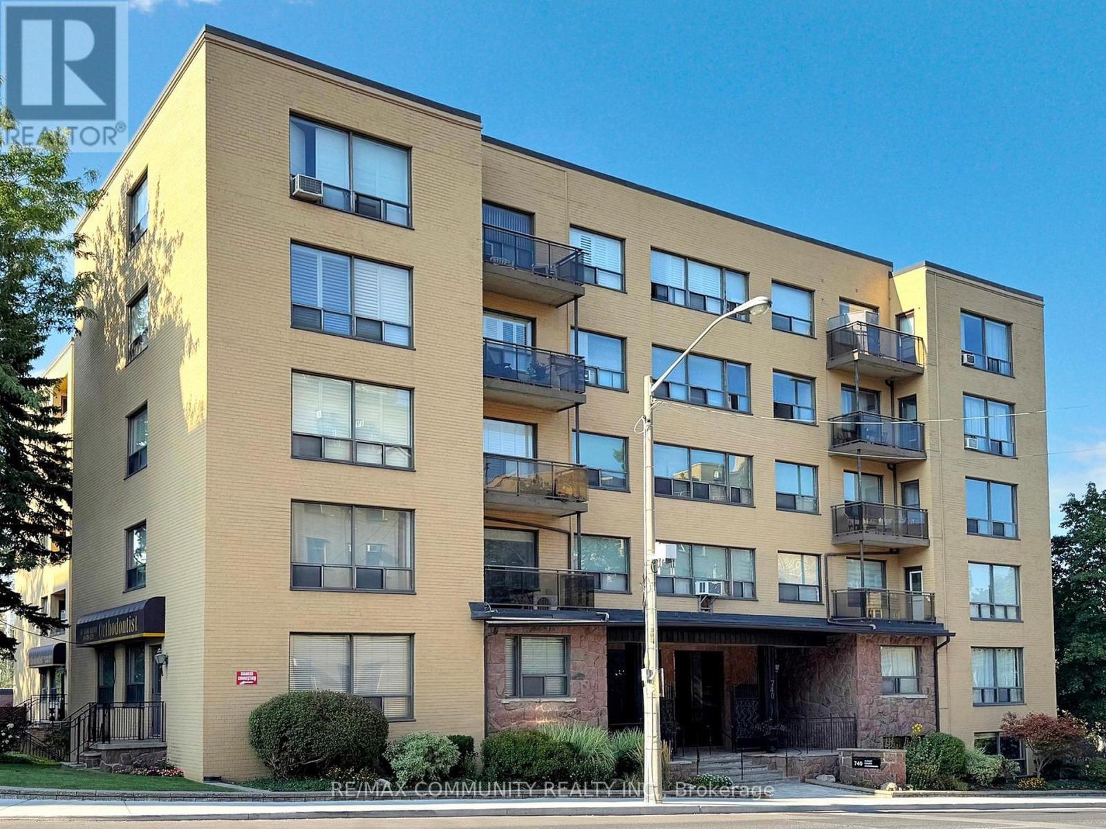 309 - 740 Eglinton Avenue W, Toronto, ON - Outdoor With Balcony With Facade