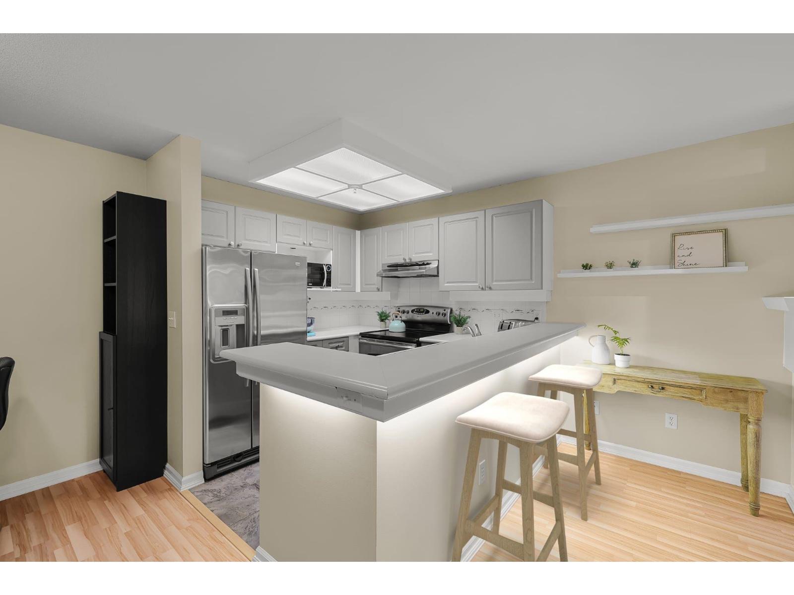 210 22025 48 Avenue, Langley, BC - Indoor Photo Showing Kitchen With Stainless Steel Kitchen