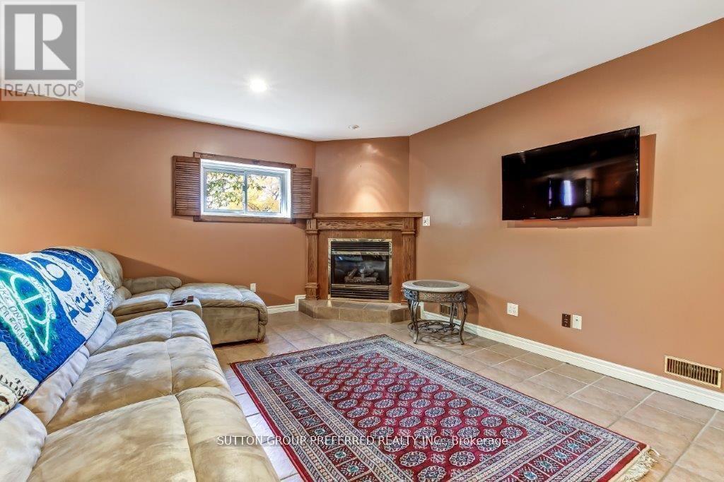 296 Bournemouth Drive, London East (East I), ON - Indoor Photo Showing Living Room With Fireplace