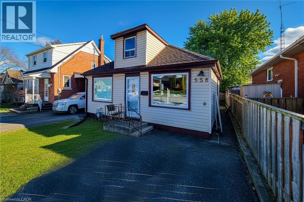 Bungalow-style home featuring a shingled roof - 558 Barnaby Street, Hamilton, ON - Outdoor