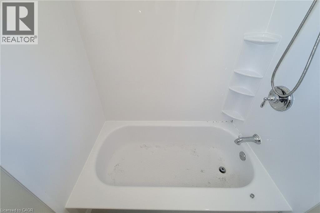 Full bathroom featuring tub / shower combination - 558 Barnaby Street, Hamilton, ON - Indoor Photo Showing Bathroom