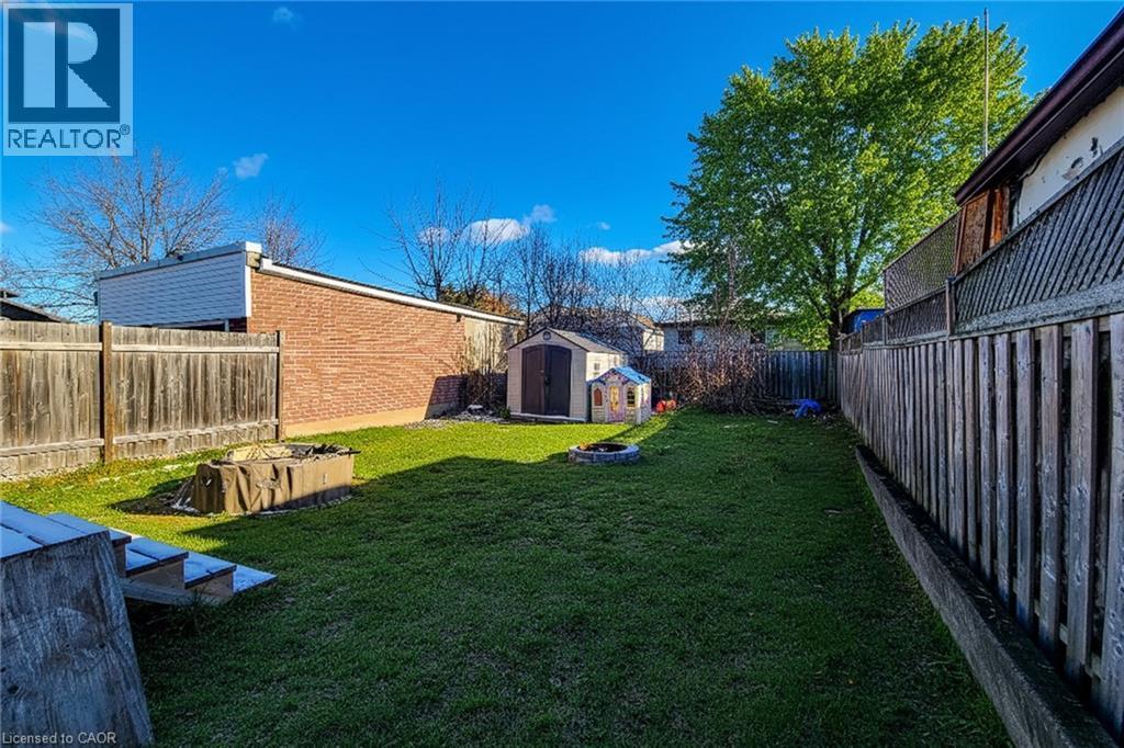 Fenced backyard featuring a shed - 558 Barnaby Street, Hamilton, ON - Outdoor