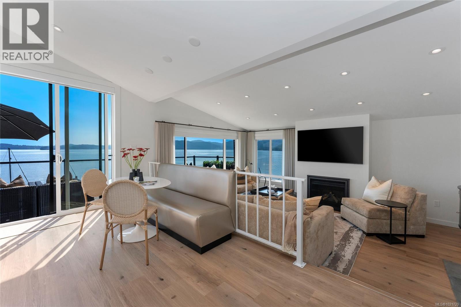 Living area with vaulted ceiling, vaulted ceiling and gas fireplace - 4 1723 Sandy Beach Rd, Mill Bay, BC - Indoor Photo Showing Other Room With Fireplace