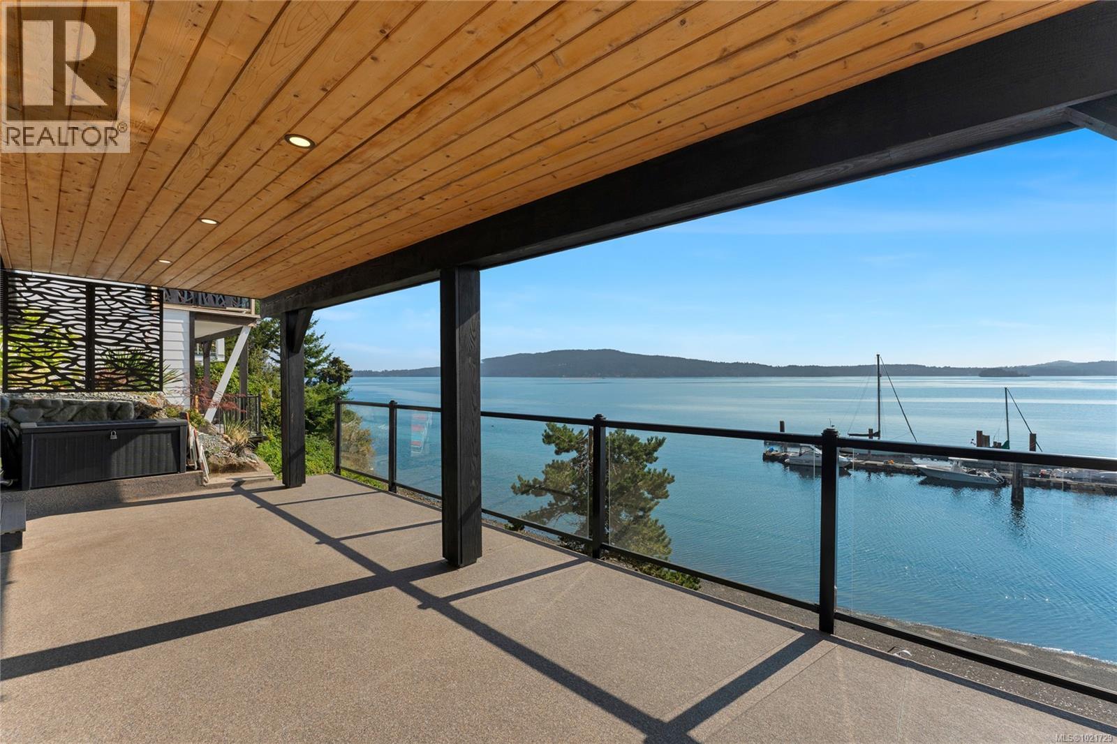 Covered lower deck features 180-degree water views - 4 1723 Sandy Beach Rd, Mill Bay, BC - Outdoor With Body Of Water With View