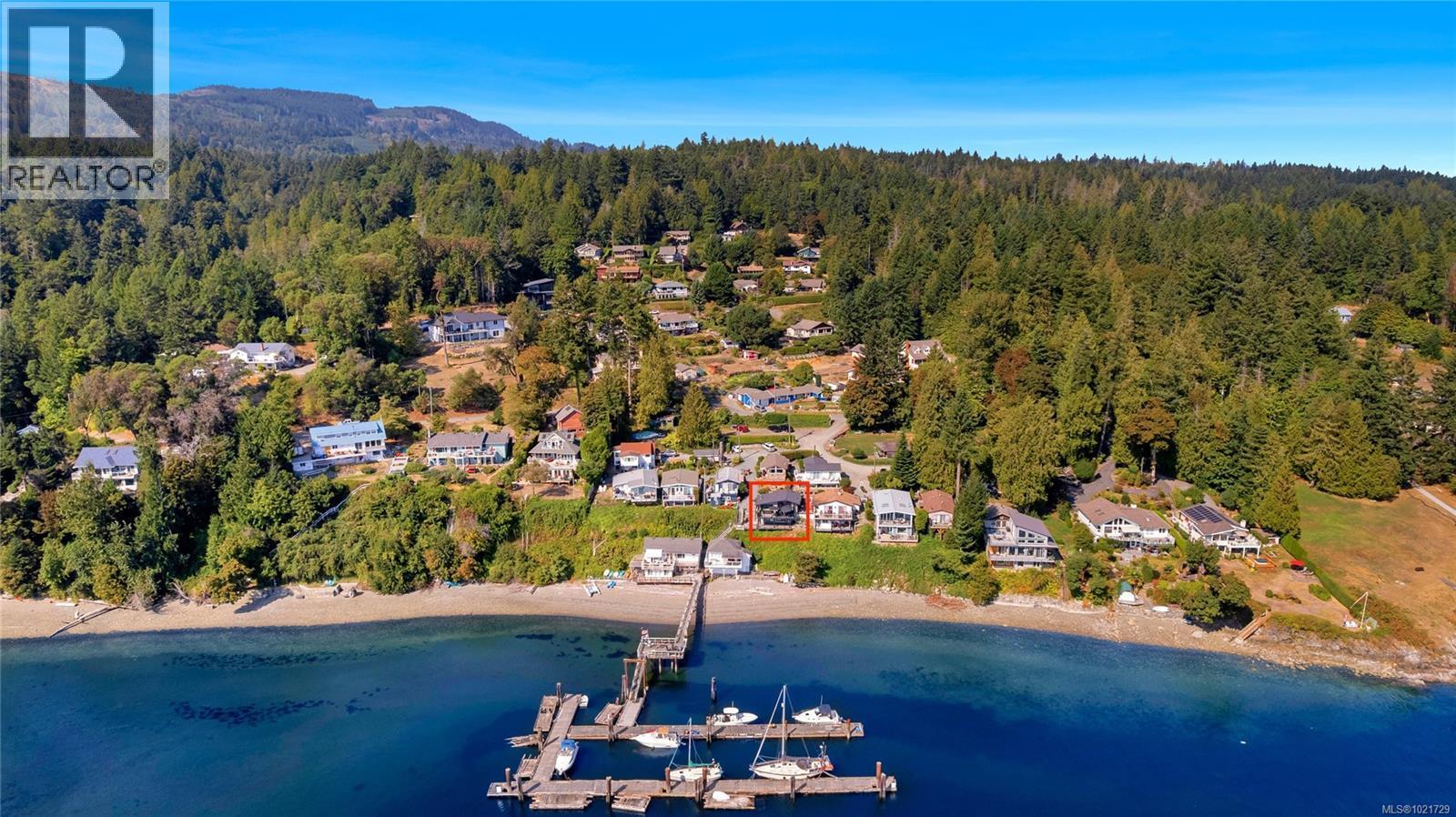 Aerial overview of private Sandy Beach community and dock - 4 1723 Sandy Beach Rd, Mill Bay, BC - Outdoor With Body Of Water With View