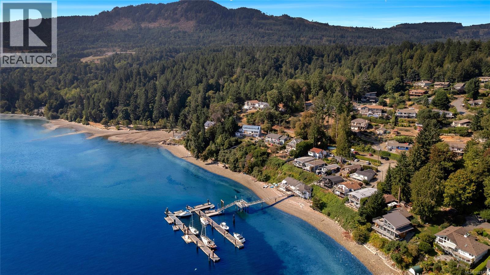 Aerial view of Sandy Beach community and dock - 4 1723 Sandy Beach Rd, Mill Bay, BC - Outdoor With Body Of Water With View