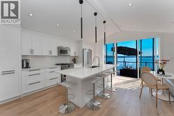 Kitchen opens to upper deck -