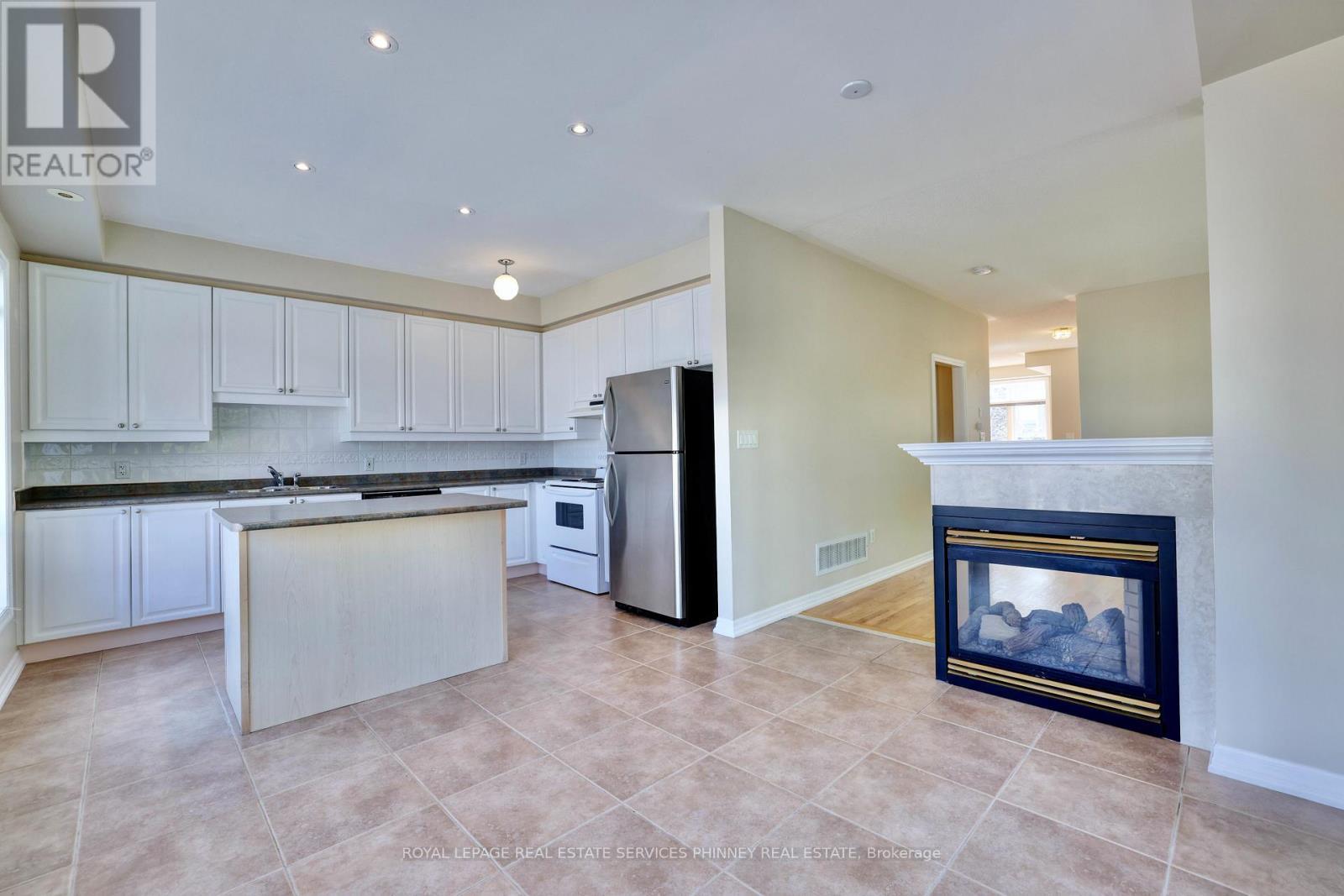 165 Lakeshore Road E, Mississauga, ON - Indoor Photo Showing Kitchen With Fireplace