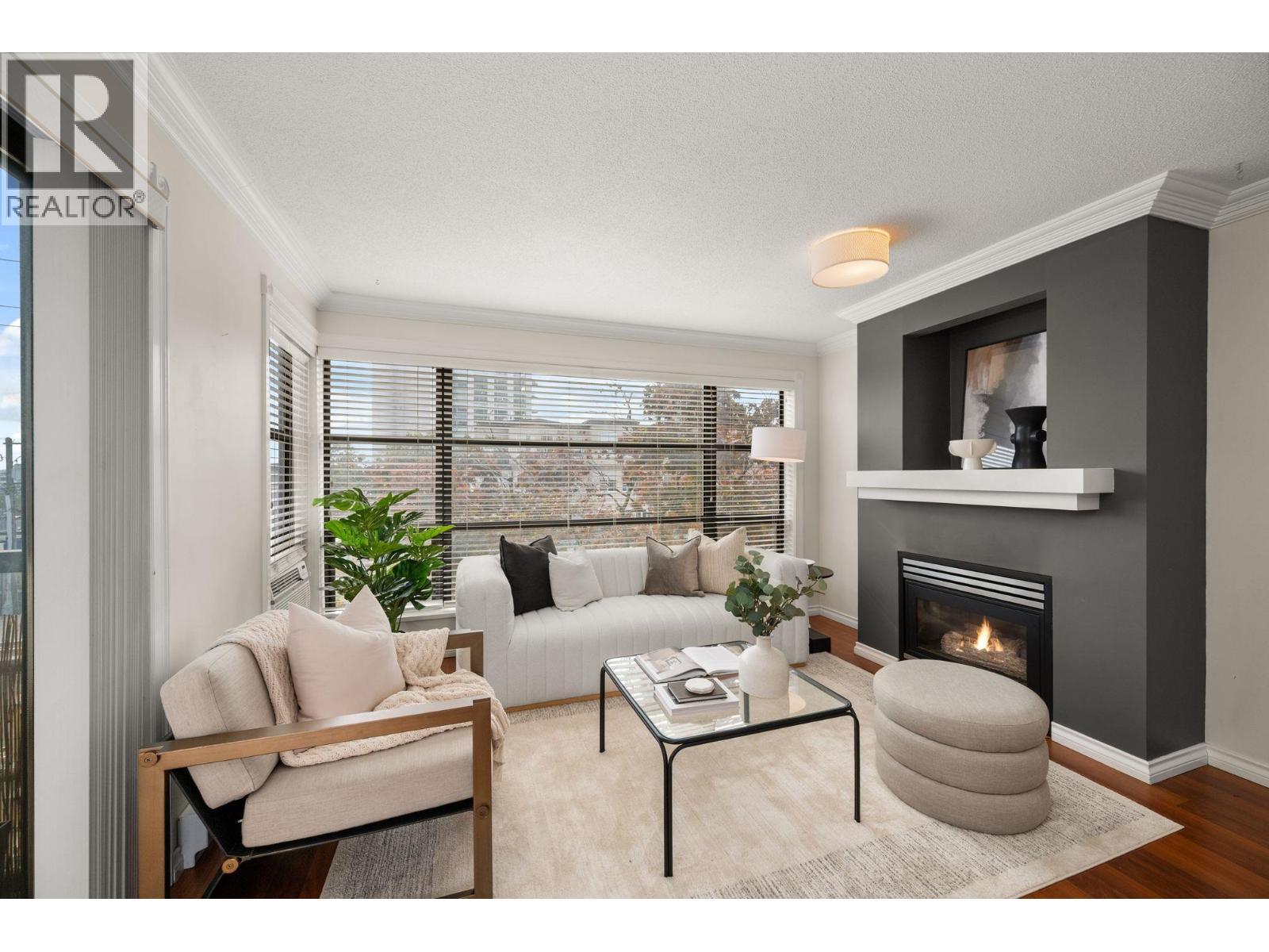 301 124 W 3Rd Street, North Vancouver, BC - Indoor Photo Showing Living Room With Fireplace