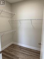 Walk in closet in primary bedroom -