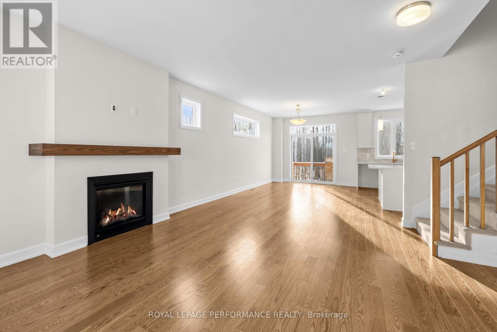 10 Academie Street, Russell, ON - Indoor Photo Showing Living Room With Fireplace