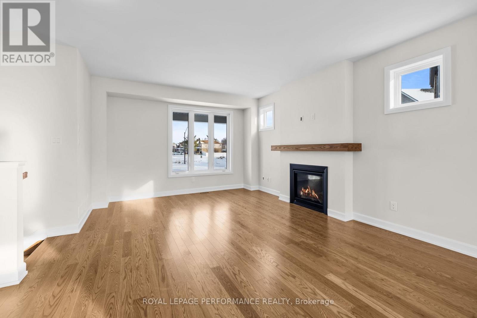 10 Academie Street, Russell, ON - Indoor Photo Showing Living Room With Fireplace
