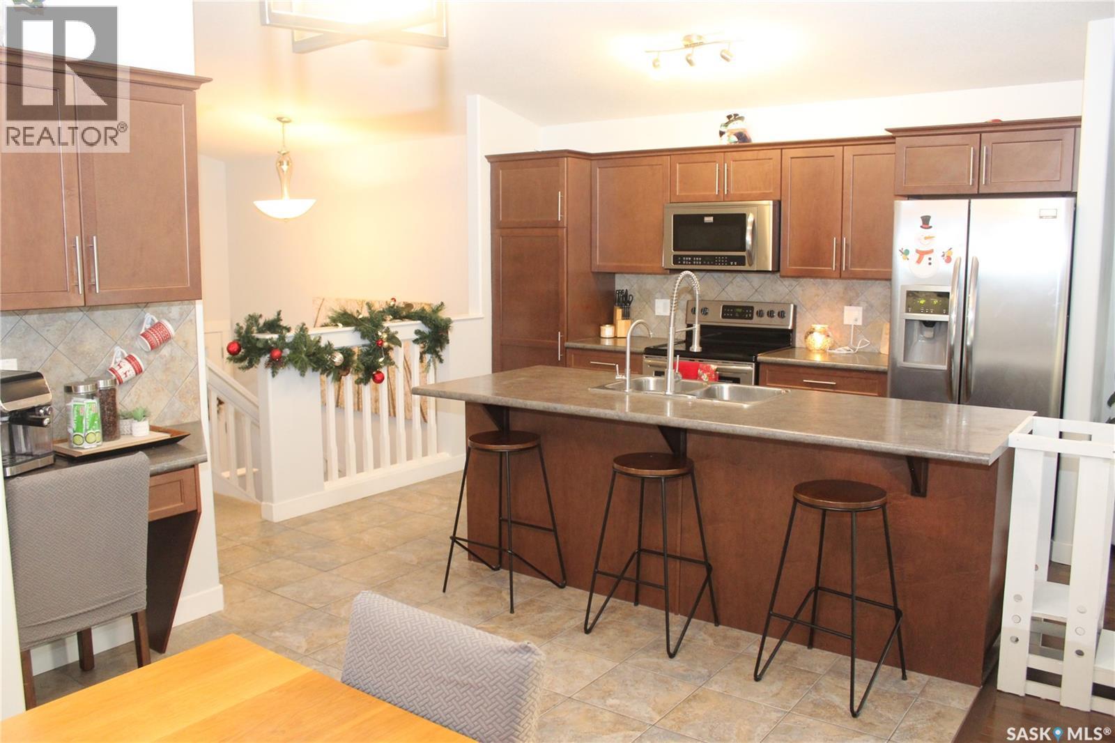 3330 Green Moss Lane, Regina, SK - Indoor Photo Showing Kitchen With Double Sink