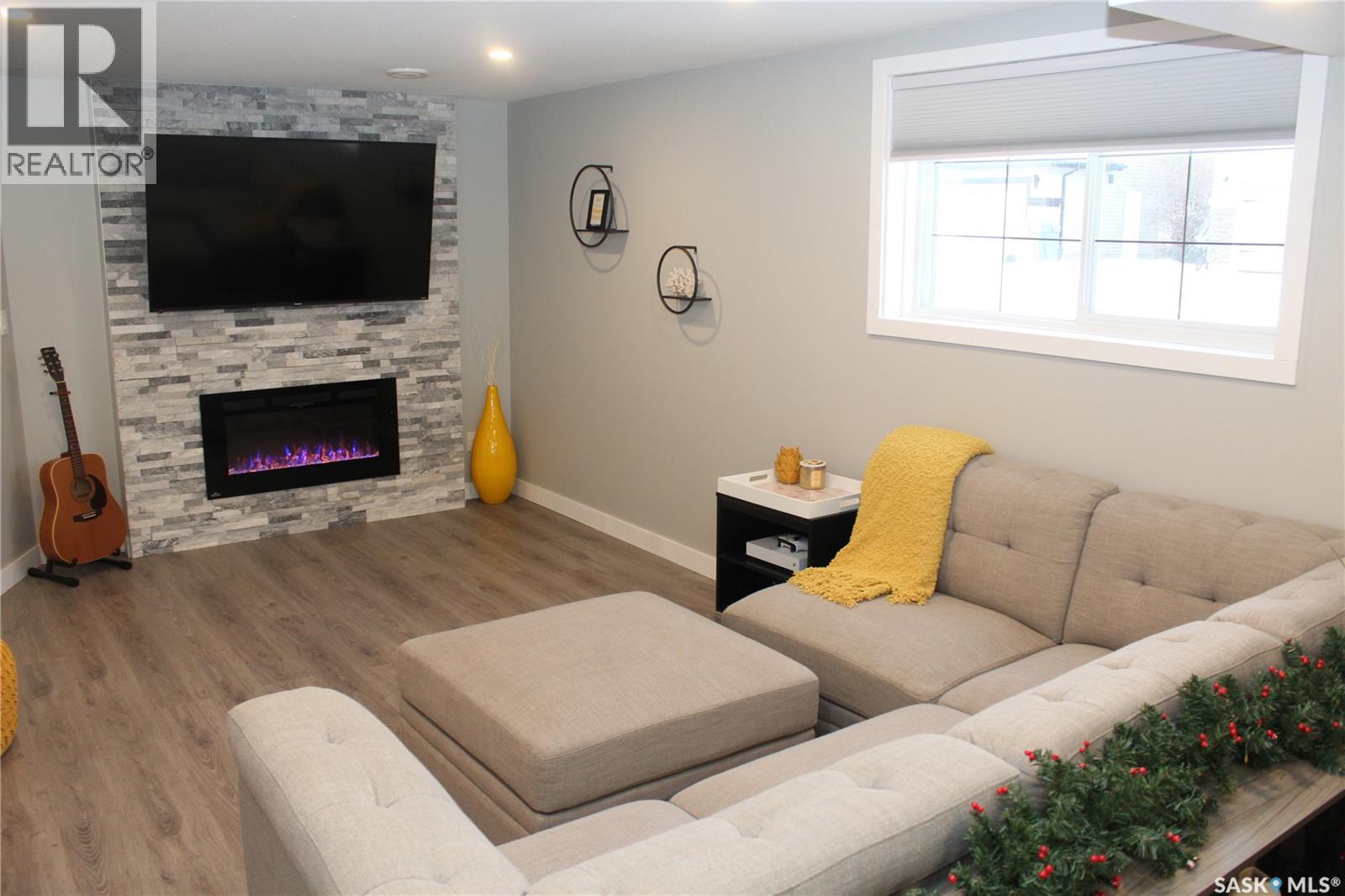 3330 Green Moss Lane, Regina, SK - Indoor Photo Showing Living Room With Fireplace