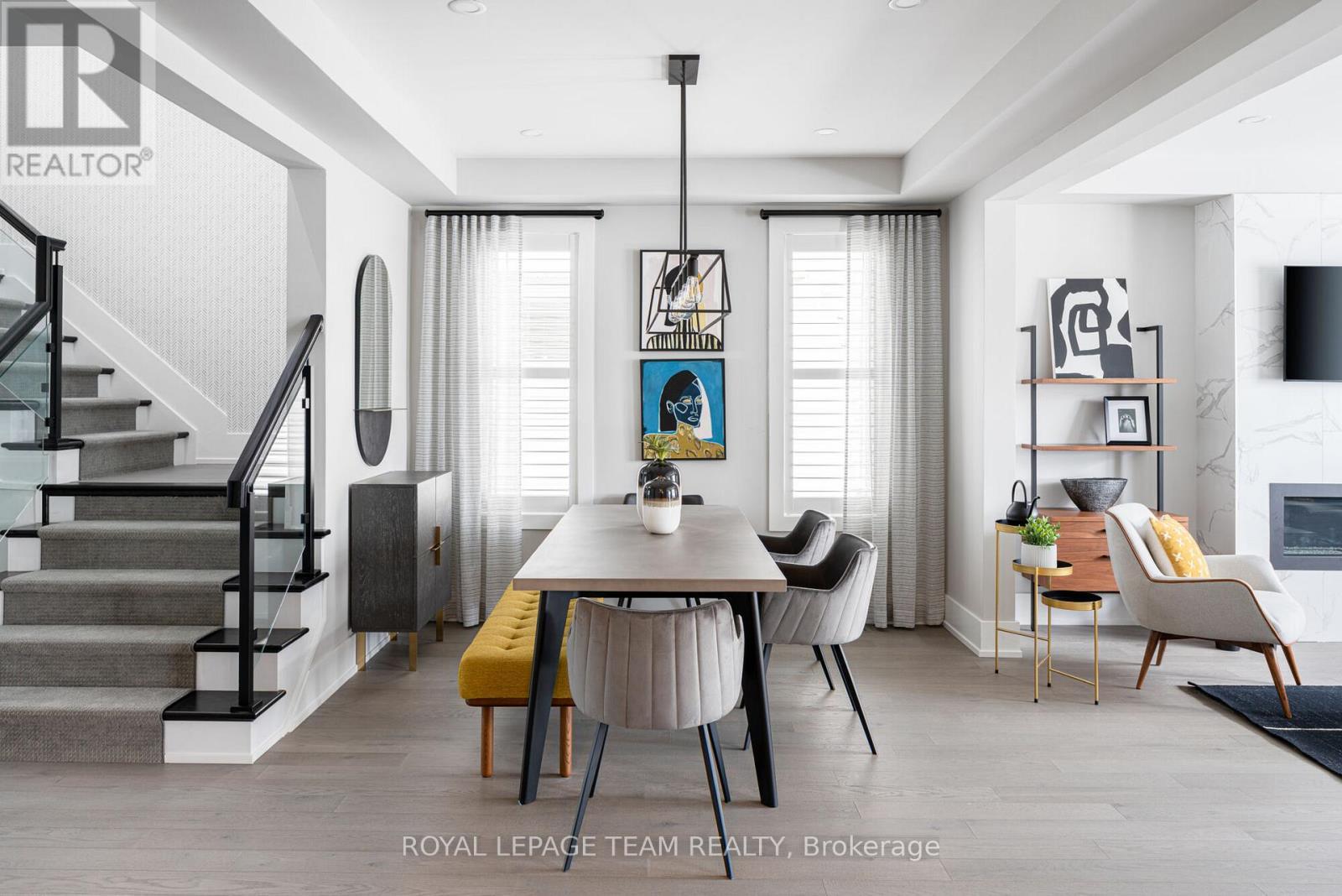 Images provided are to showcase builder finishes - 919 Finescale Way, Ottawa, ON - Indoor Photo Showing Dining Room With Fireplace