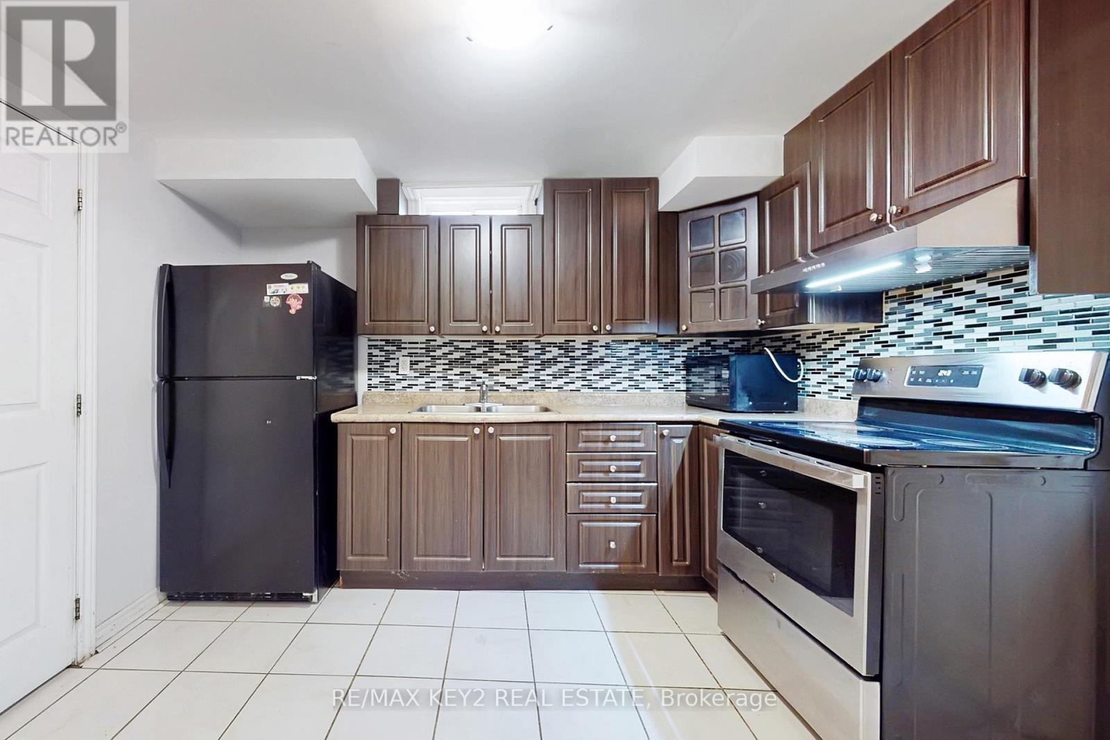 Bsmt - 58 Hummingbird Drive, Toronto, ON - Indoor Photo Showing Kitchen With Double Sink