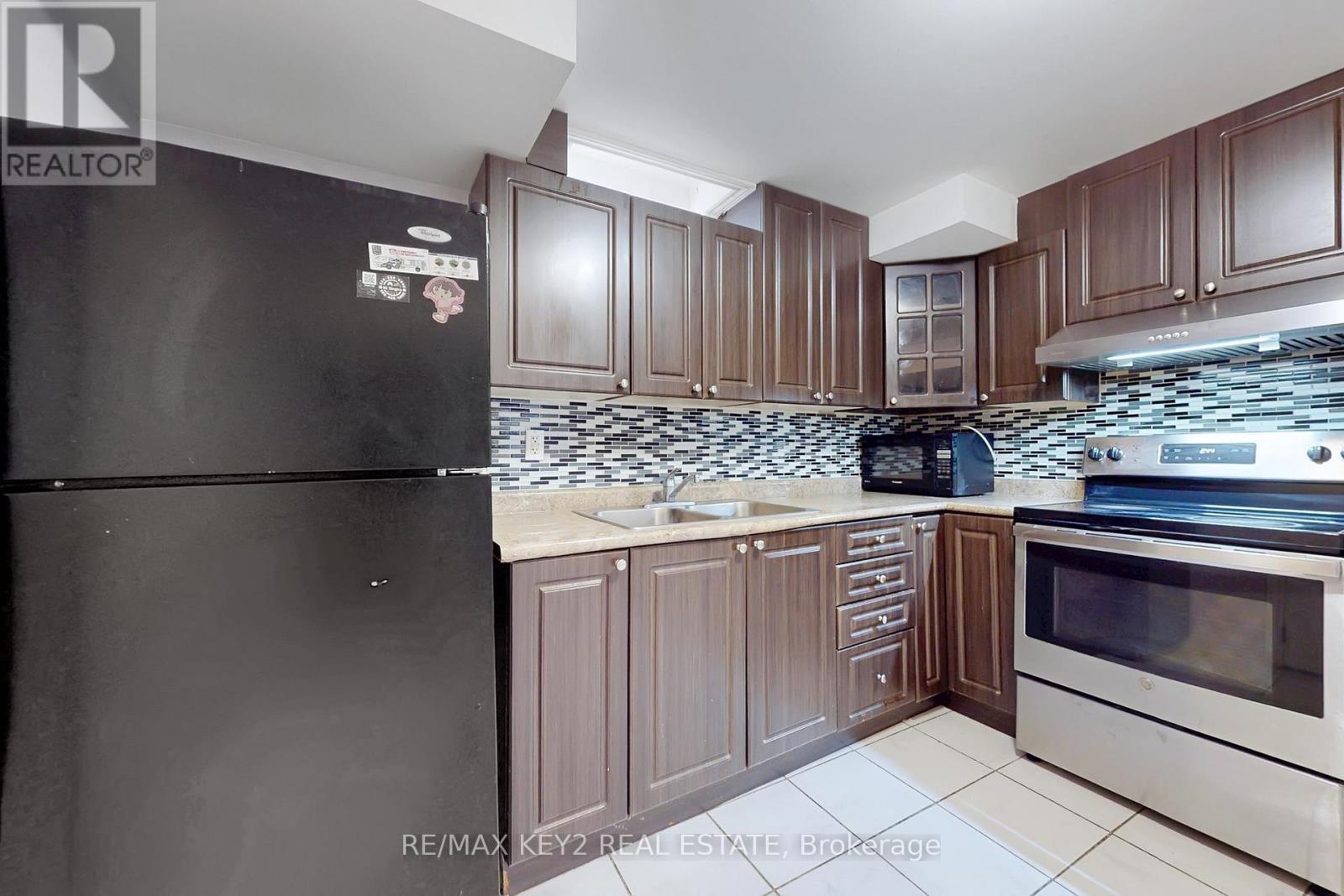 Bsmt - 58 Hummingbird Drive, Toronto, ON - Indoor Photo Showing Kitchen With Double Sink