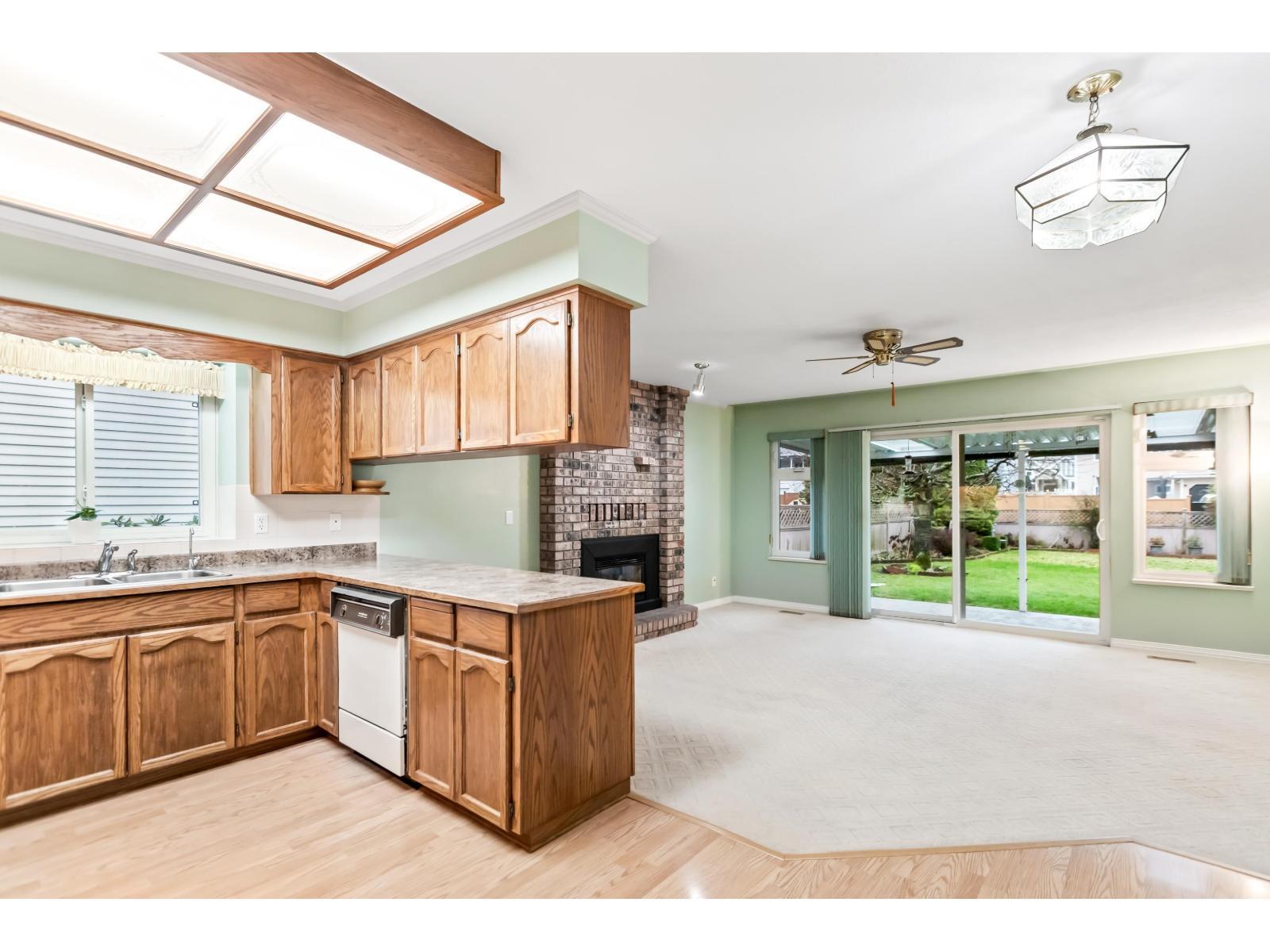 9263 156A Street, Surrey, BC - Indoor Photo Showing Kitchen With Fireplace With Double Sink
