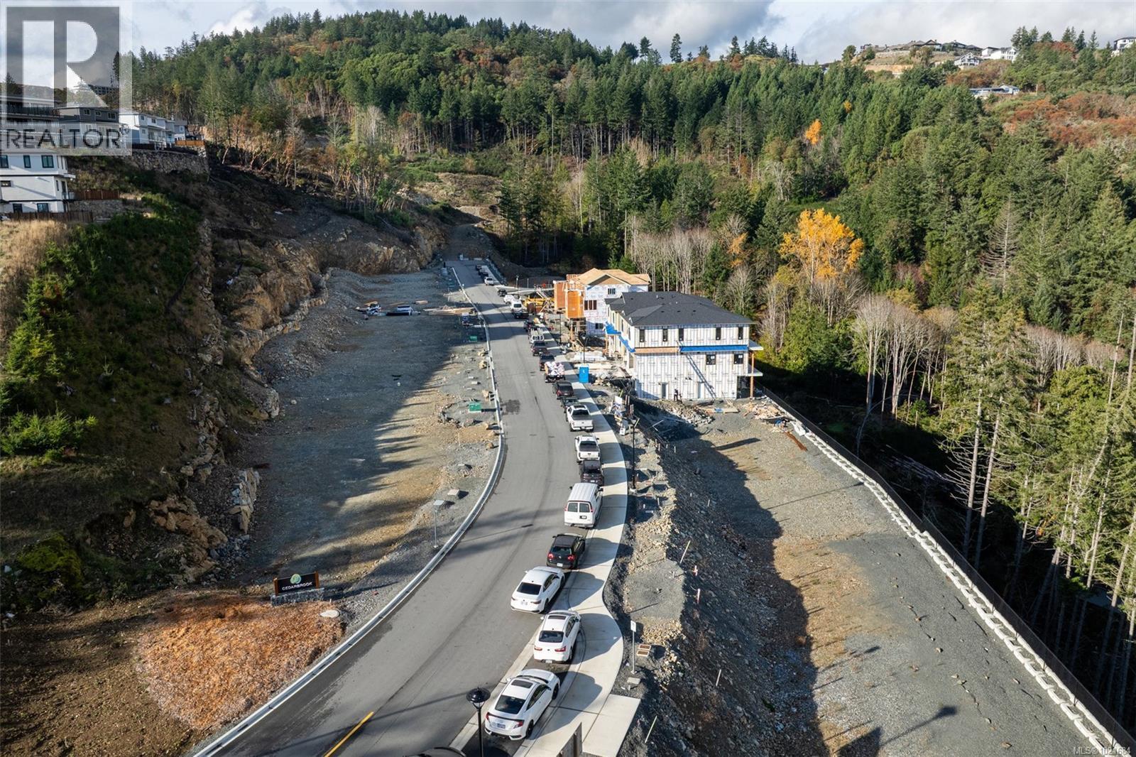 View of property location featuring a heavily wooded area - 1204 Cedarbrook Way, Langford, BC