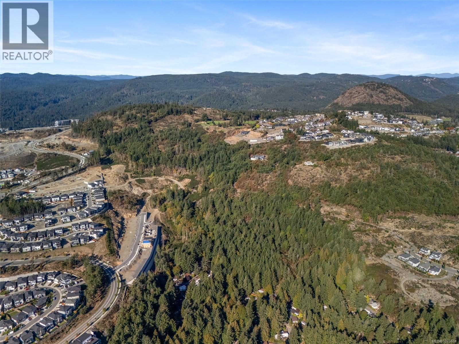 Aerial view of property's location featuring a mountainous background - 1204 Cedarbrook Way, Langford, BC