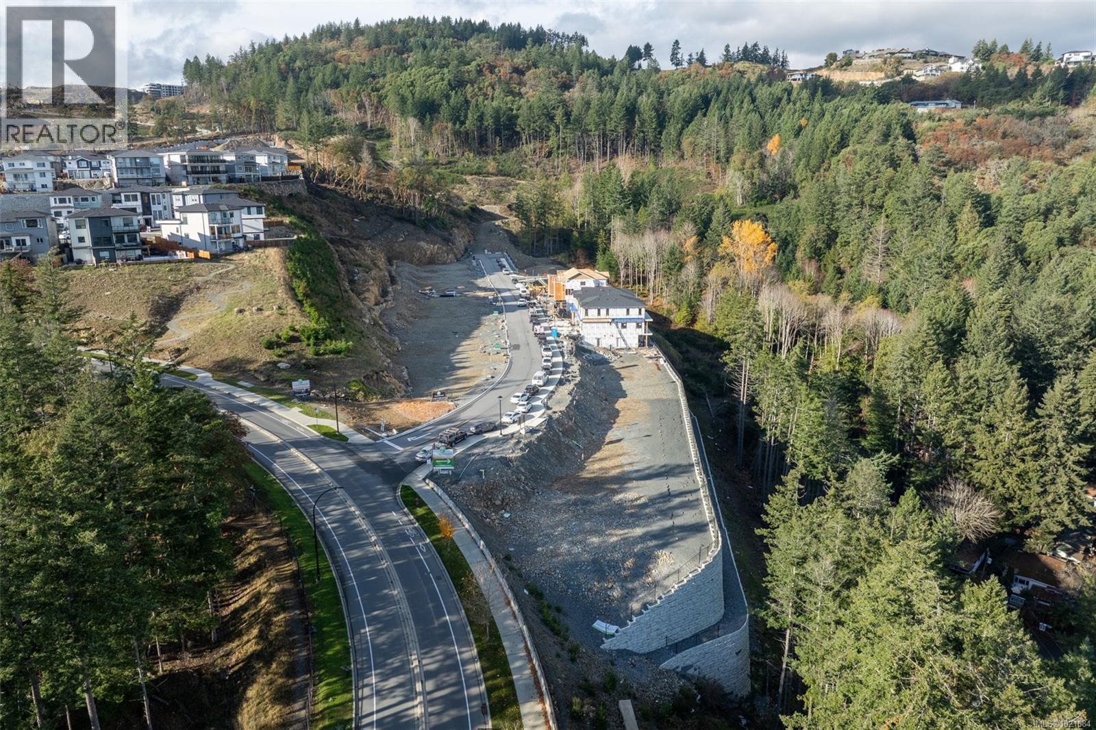 Aerial view of property and surrounding area with a heavily wooded area - 1204 Cedarbrook Way, Langford, BC