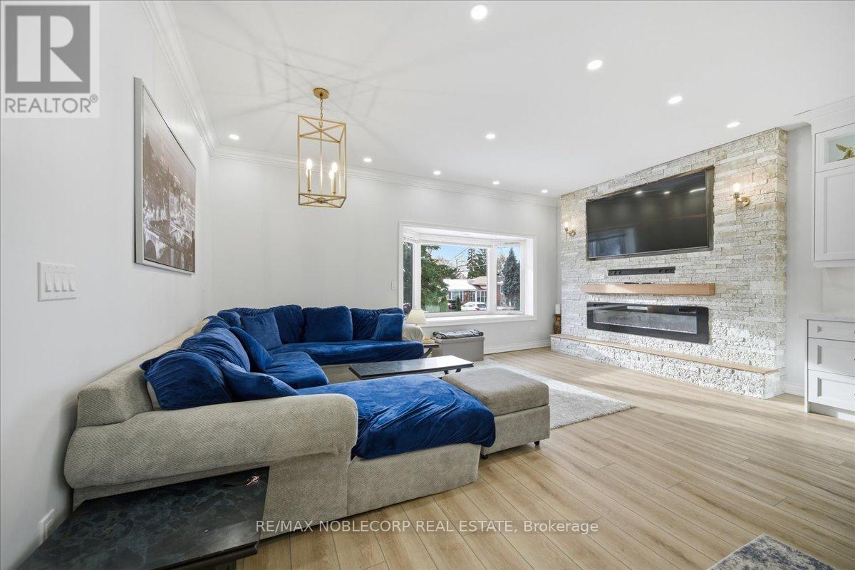 Main - 18 Florida Crescent, Toronto, ON - Indoor Photo Showing Living Room With Fireplace