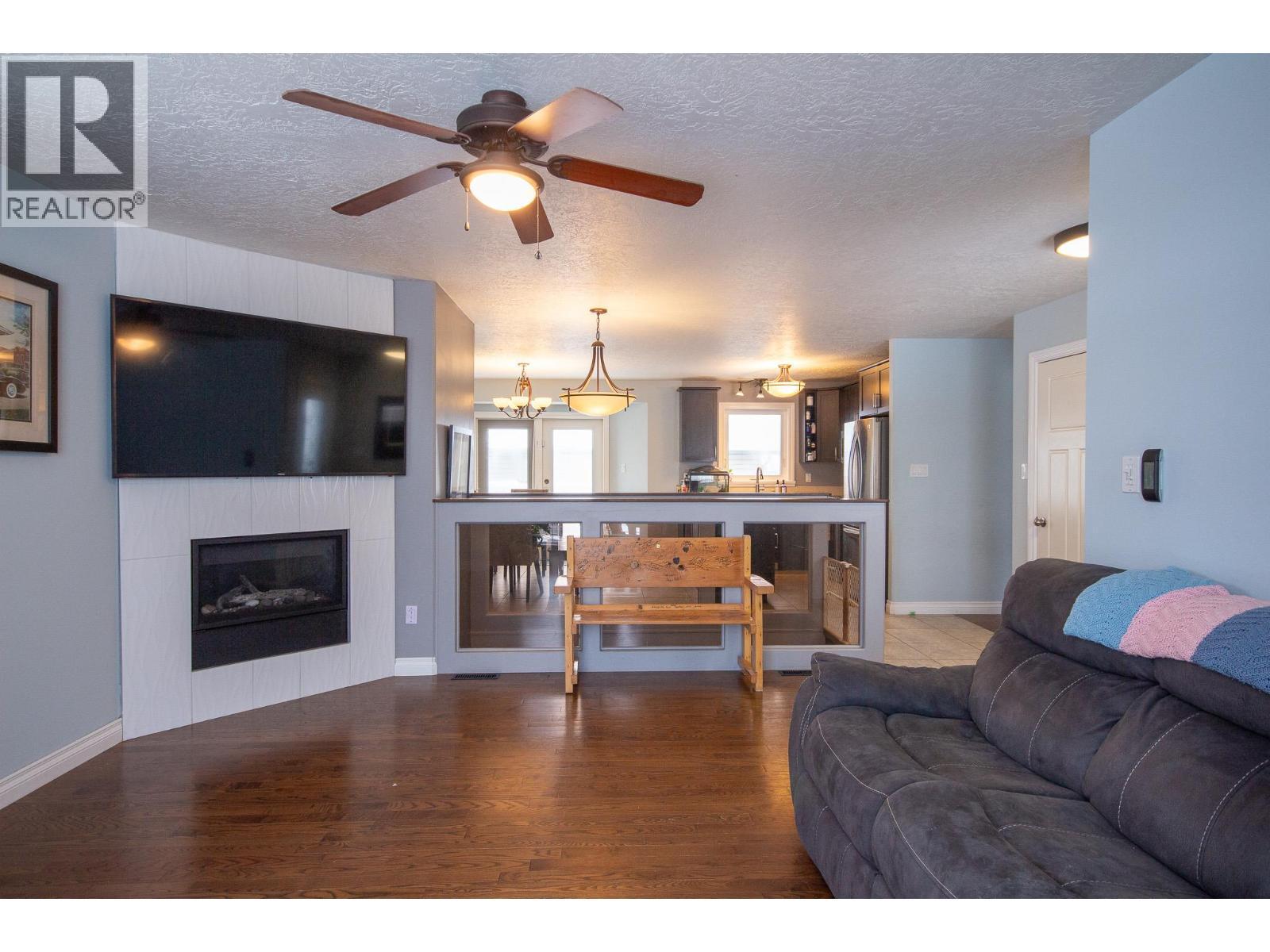 1717 87 Avenue, Dawson Creek, BC - Indoor Photo Showing Living Room With Fireplace