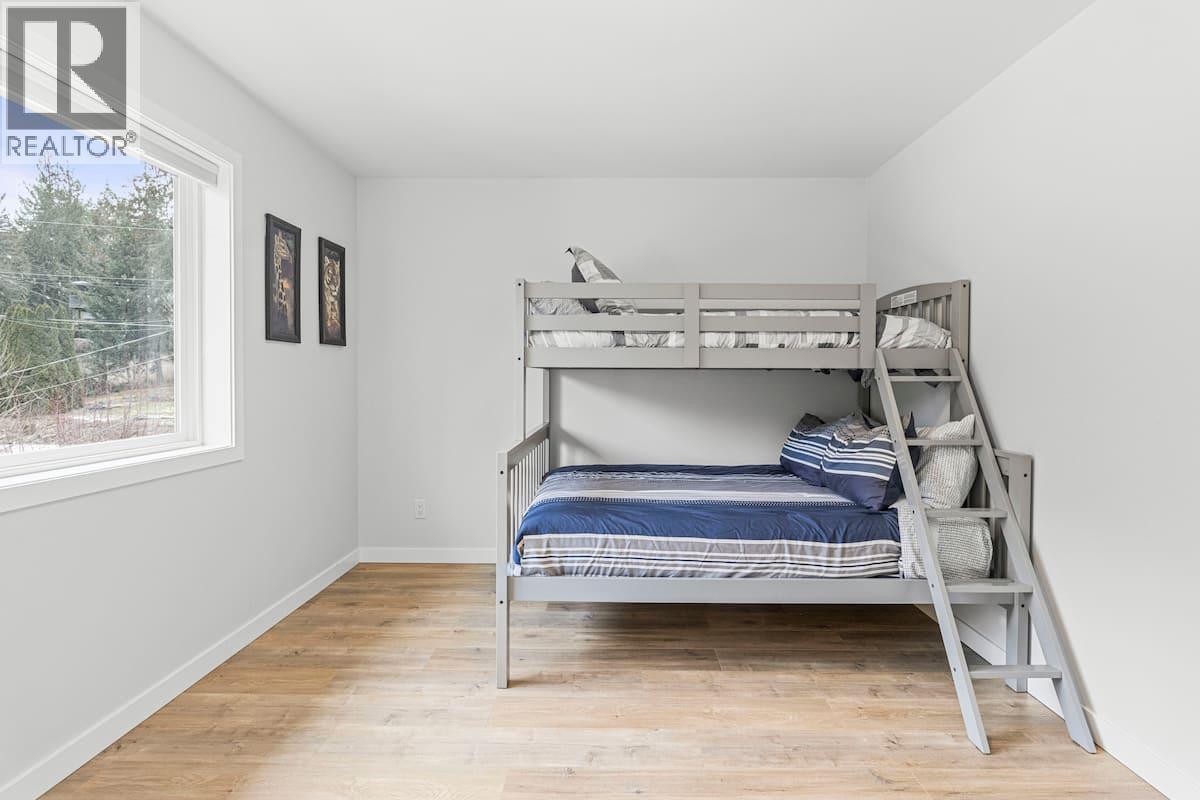 Bedroom #2 is upstairs - 3040 Cedar Drive, Blind Bay, BC - Indoor Photo Showing Bedroom