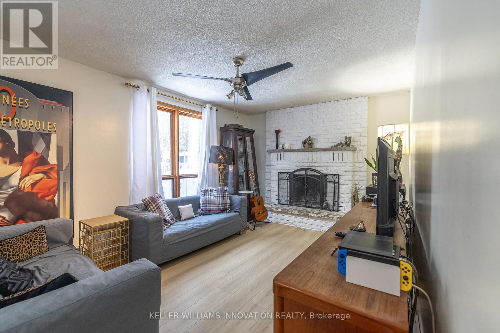 104 Henry Street, Guelph/Eramosa, ON - Indoor Photo Showing Living Room With Fireplace