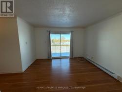 Livingroom showing patio doors to balcony -