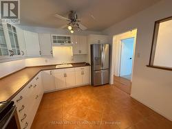 Plenty of cupboards & counter space. -