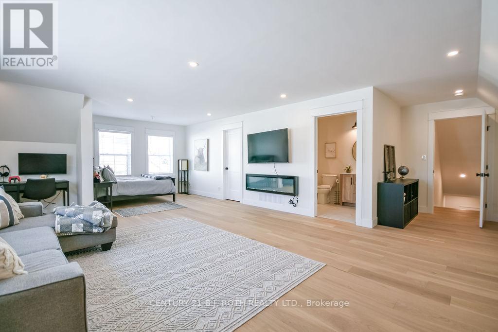 63 Highland Drive, Oro-Medonte, ON - Indoor Photo Showing Living Room With Fireplace