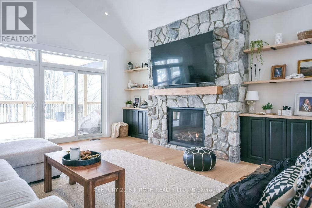 63 Highland Drive, Oro-Medonte, ON - Indoor Photo Showing Living Room With Fireplace
