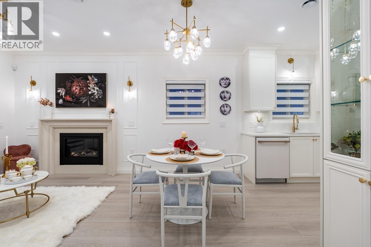 5136 Dominion Street, Burnaby, BC - Indoor Photo Showing Dining Room With Fireplace