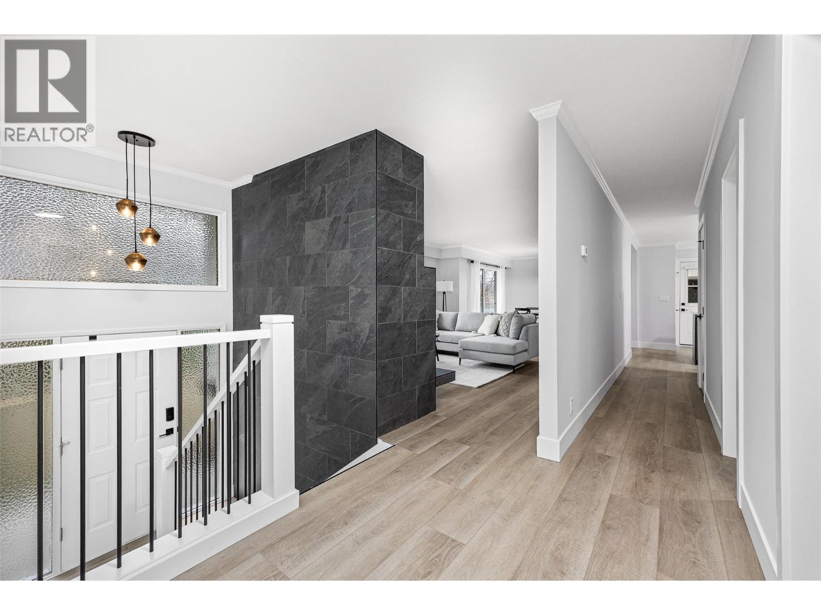 Bi-level entrance with high ceilings & feature lighting - 2757 Paula Road, West Kelowna, BC - Indoor Photo Showing Other Room