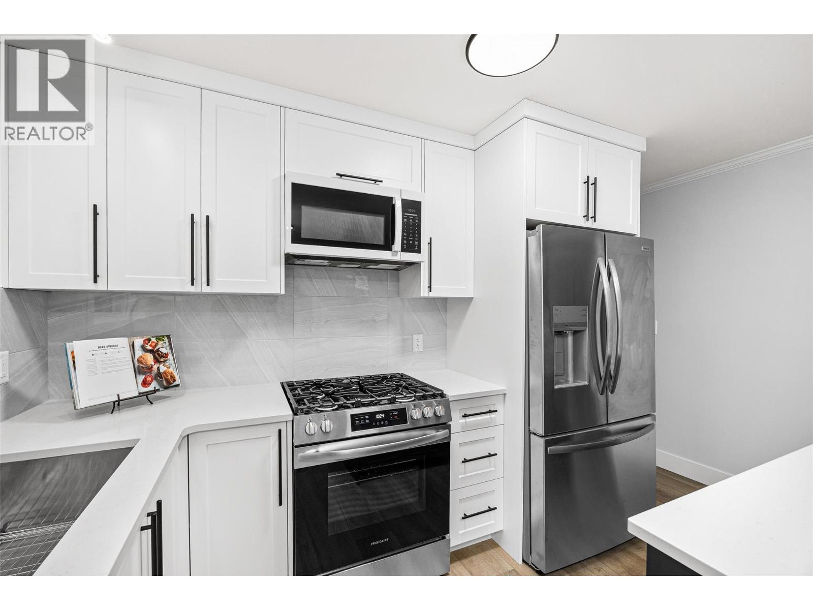 Fully Updated kitchen l Main level - 2757 Paula Road, West Kelowna, BC - Indoor Photo Showing Kitchen With Stainless Steel Kitchen
