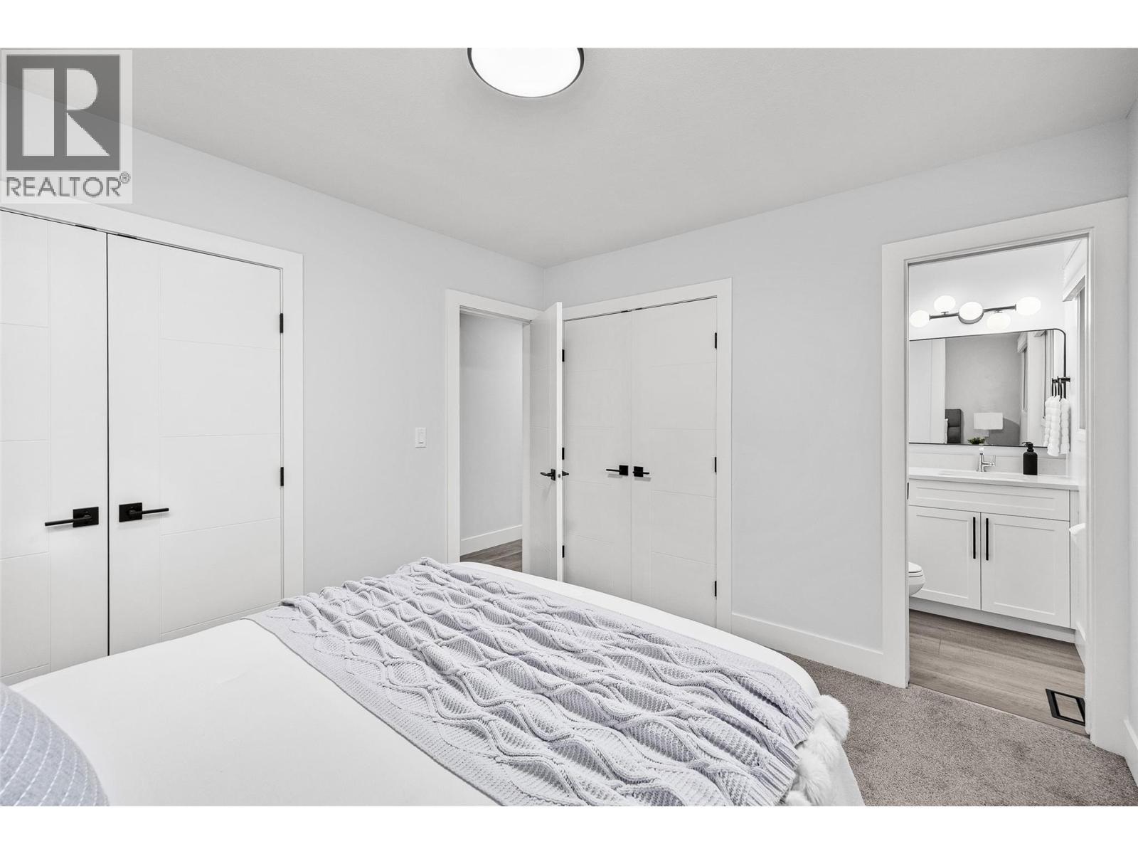 Bedroom #1 l Main Level - with 3 piece ensuite - 2757 Paula Road, West Kelowna, BC - Indoor Photo Showing Bedroom