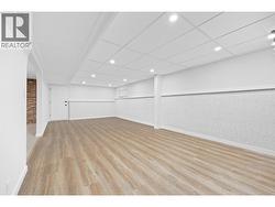 Versatile Rec Room l Lower Level - Plumbed for second kitchen providing suite potential -