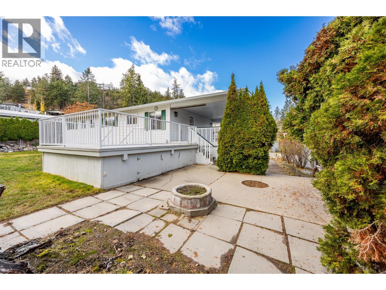 Spacious backyard space completed with fire pit, shed and pool potential! - 2757 Paula Road, West Kelowna, BC - Outdoor With Deck Patio Veranda