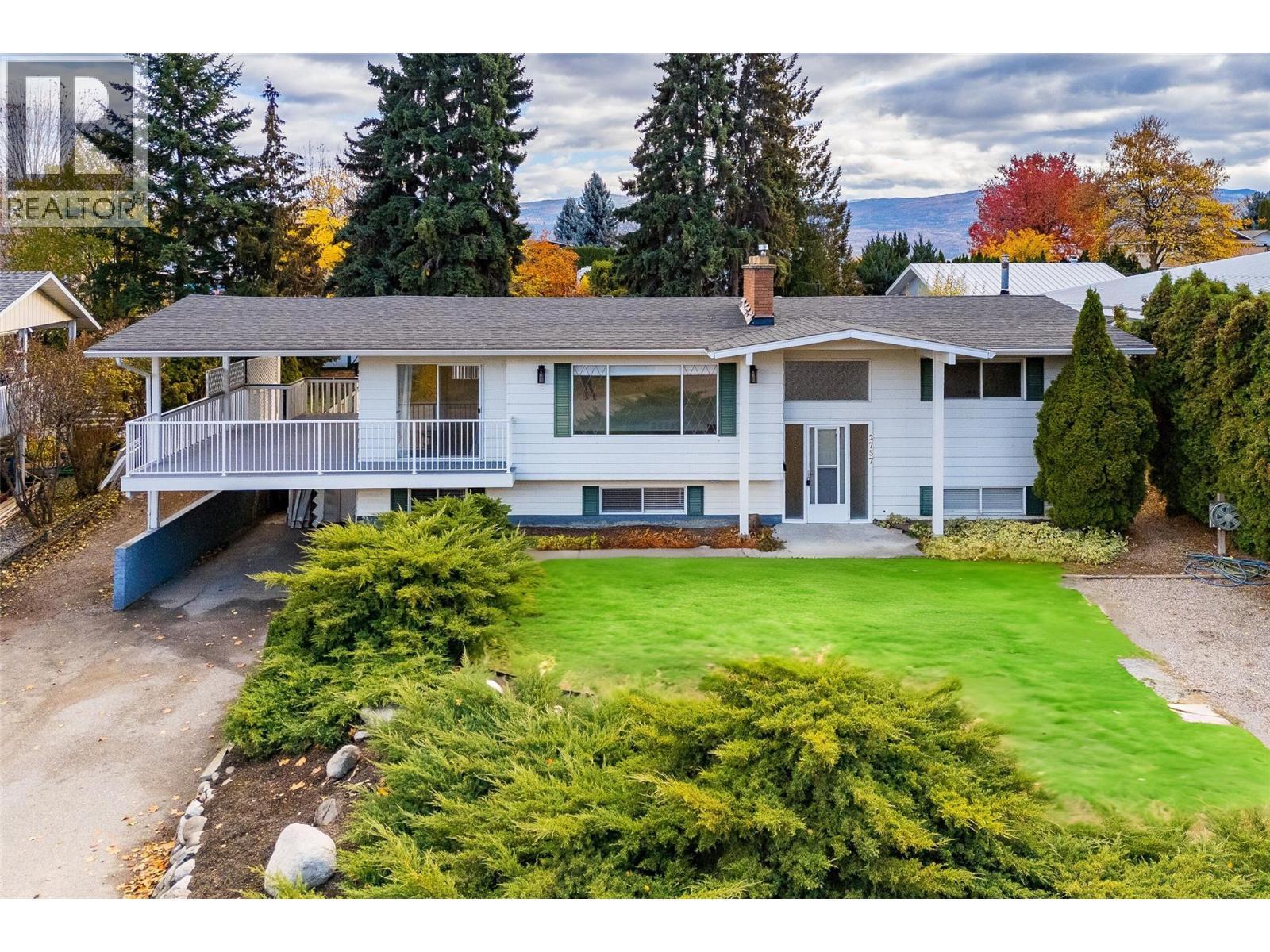 Updated 4 bed/ 3 bath home located on a sprawling .28 acre-lot in Lakeview Heights - 2757 Paula Road, West Kelowna, BC - Outdoor With Deck Patio Veranda With Facade