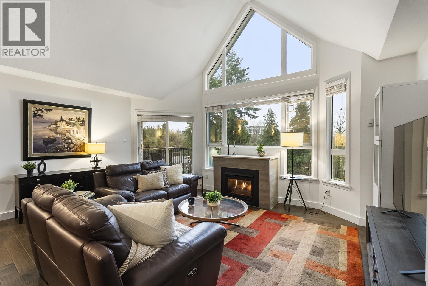 412 11595 Fraser Street, Maple Ridge, BC - Indoor Photo Showing Living Room With Fireplace