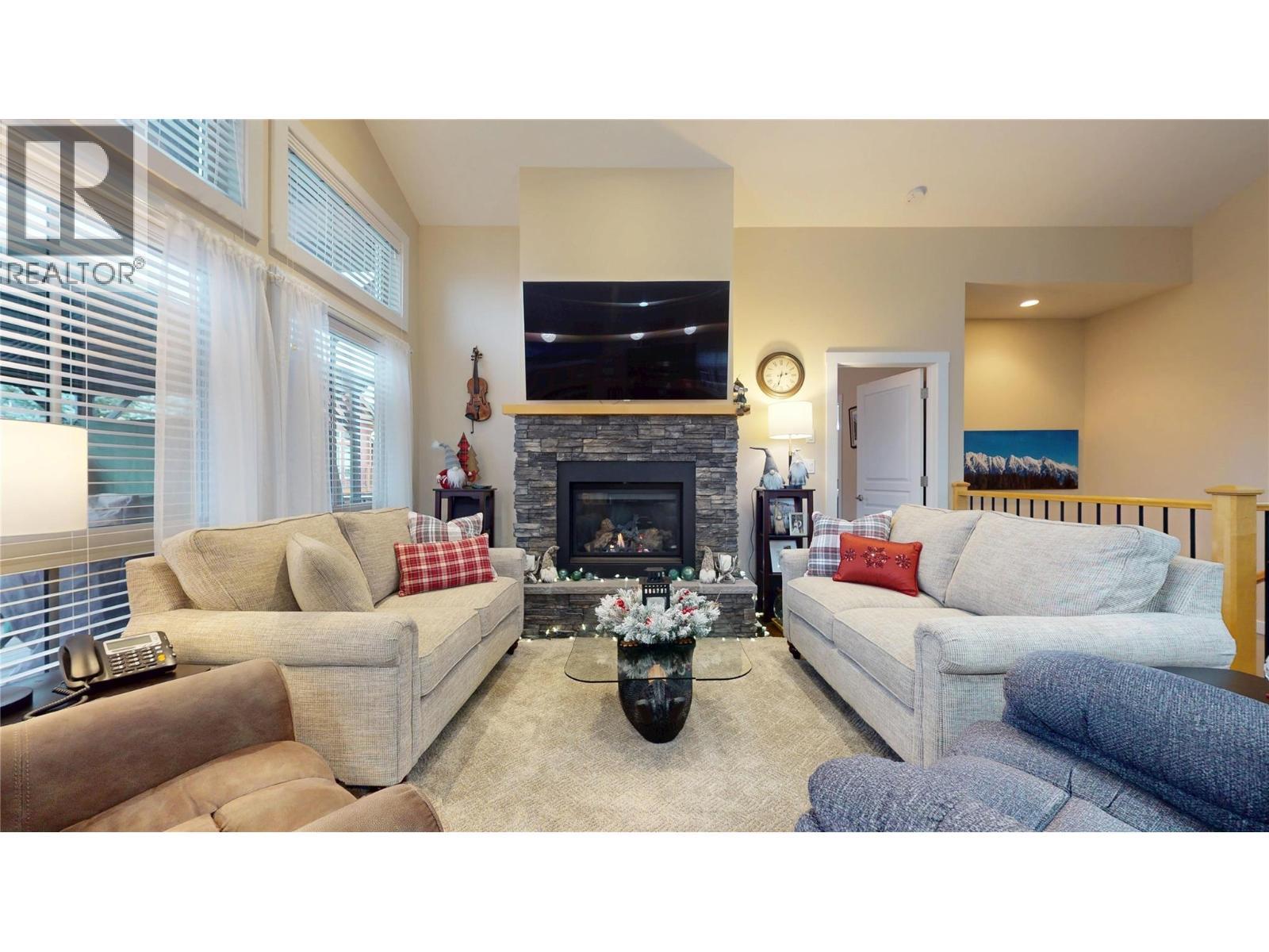 223 Boulder Creek, Cranbrook, BC - Indoor Photo Showing Living Room With Fireplace