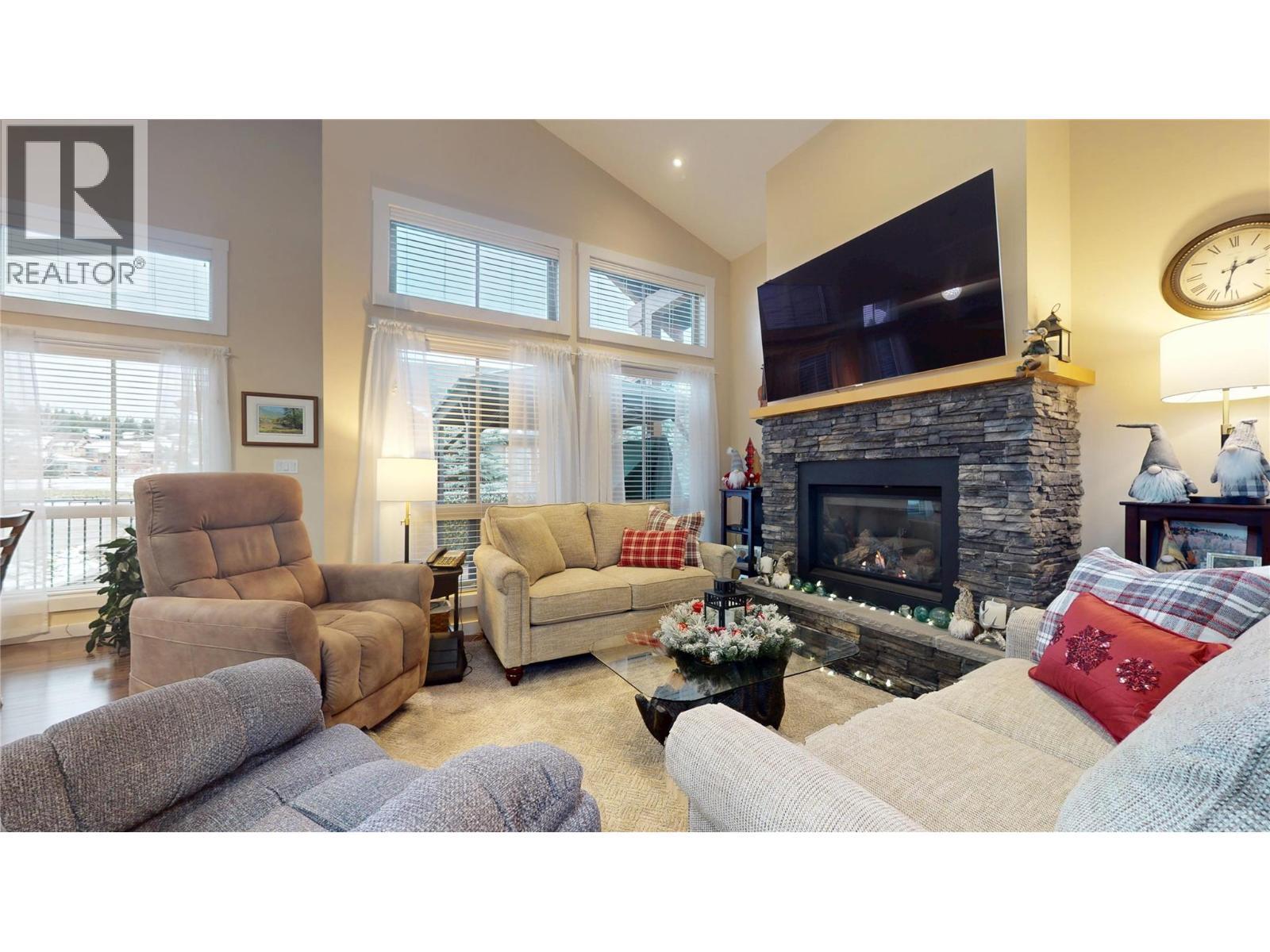 223 Boulder Creek, Cranbrook, BC - Indoor Photo Showing Living Room With Fireplace