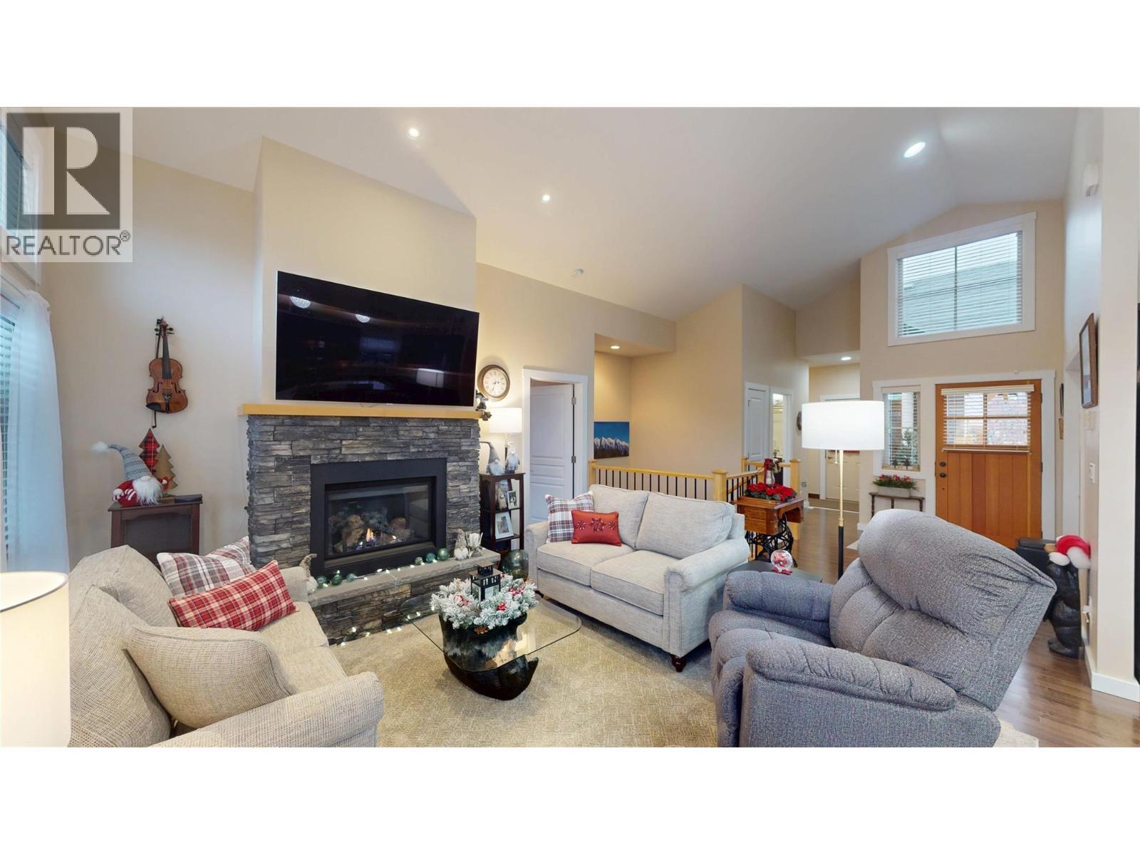 223 Boulder Creek, Cranbrook, BC - Indoor Photo Showing Living Room With Fireplace