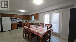 Dining room with a textured ceiling and french doors -