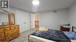 Bedroom with a closet and carpet floors -