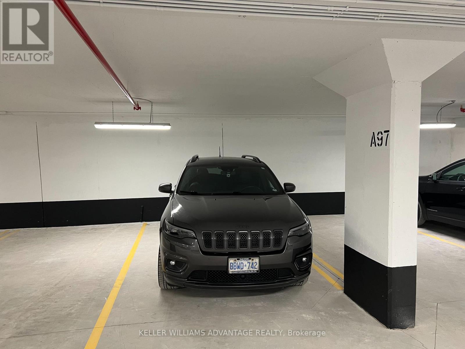 212 - 1010 Dundas Street E, Whitby, ON - Indoor Photo Showing Garage