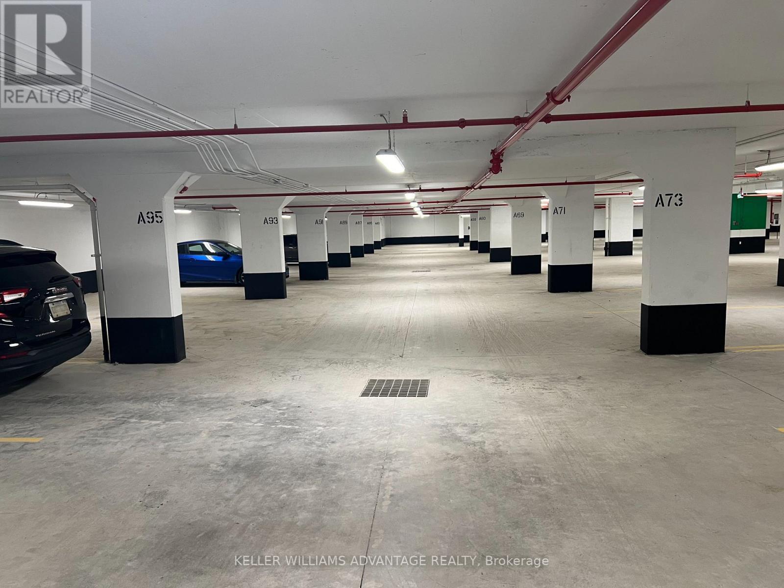 212 - 1010 Dundas Street E, Whitby, ON - Indoor Photo Showing Garage